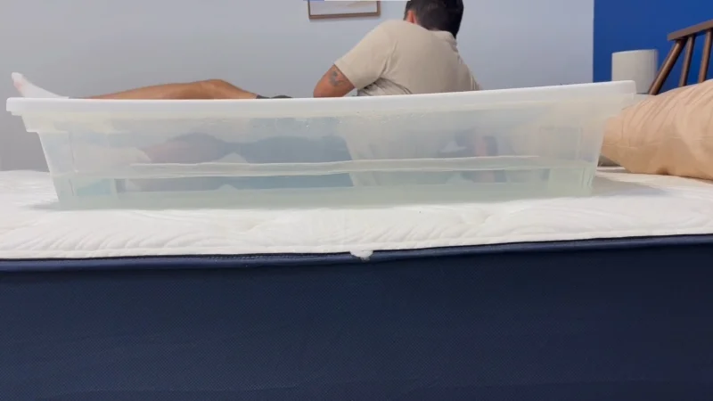 Tester Kenny Timper performs a ripple test on a Big Fig Classic Mattress