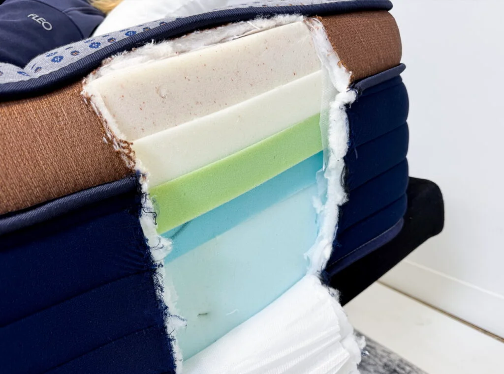 A Brooklyn Bedding CopperFlex Mattress is cut open to show the layers.