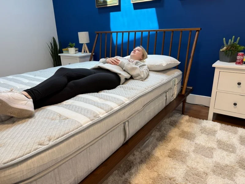 Our tester prepares for the Leesa Plus Hybrid review.