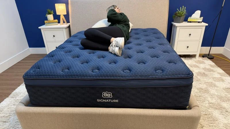 Our tester performs a switch test on the Brooklyn Bedding Signature Hybrid Mattress