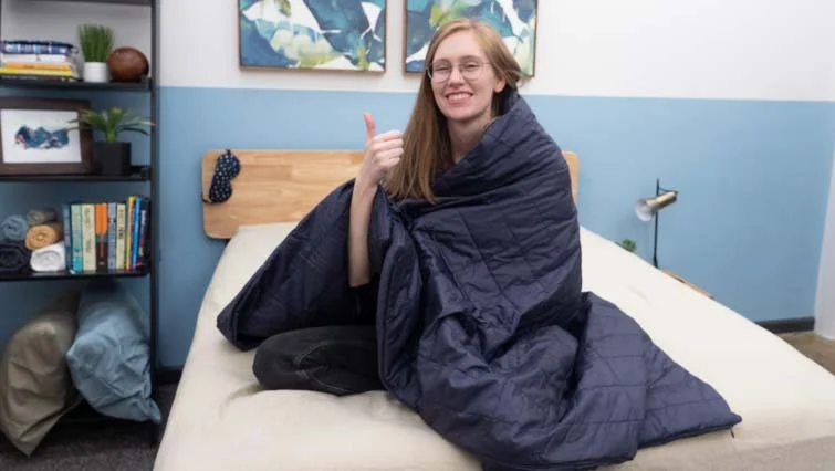 Sitting in the Sleep Number True Temp weighted blanket