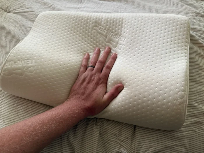 Our tester feeling a Tempur-NECK Pillow