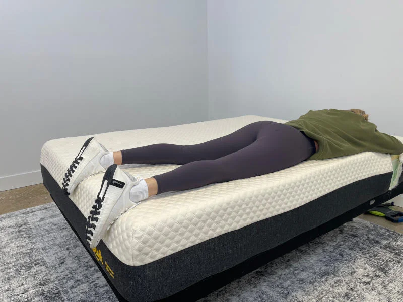 Our tester stomach-sleeping on the Nolah Signature Mattress