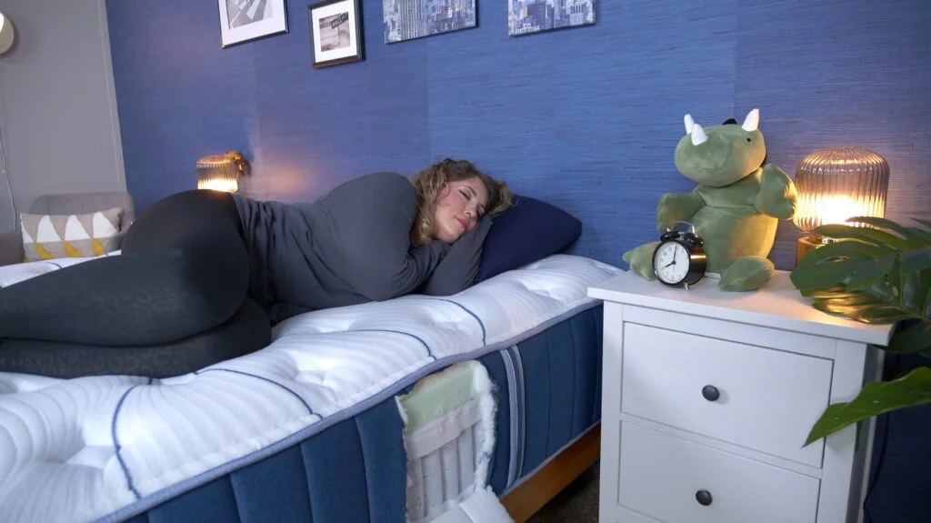 Nichole testing the Bear Elite for side sleeping