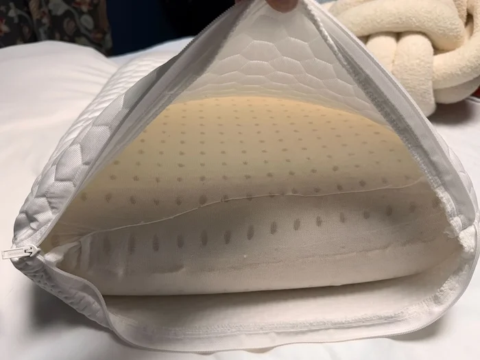 A closeup of the Helix GlacioTex Pillow being unzipped, showing the core inside.