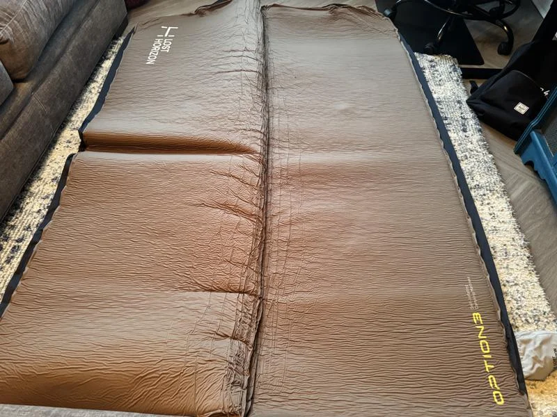 An unrolled Lost Horizon Air Foam Camping Mattress