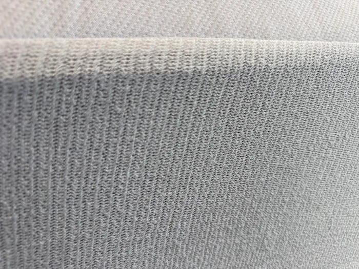 A close look at the material on a Casper Waterproof Mattress Protector.