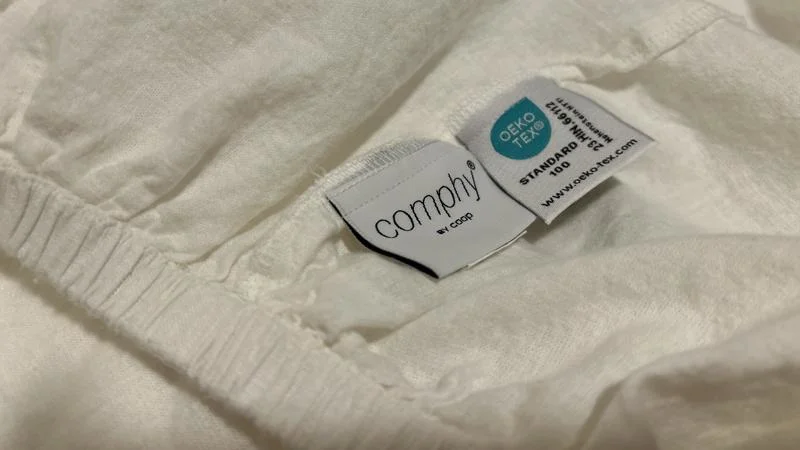 Tags on a set of Coop Sleep Goods Cotton Linen Sheets