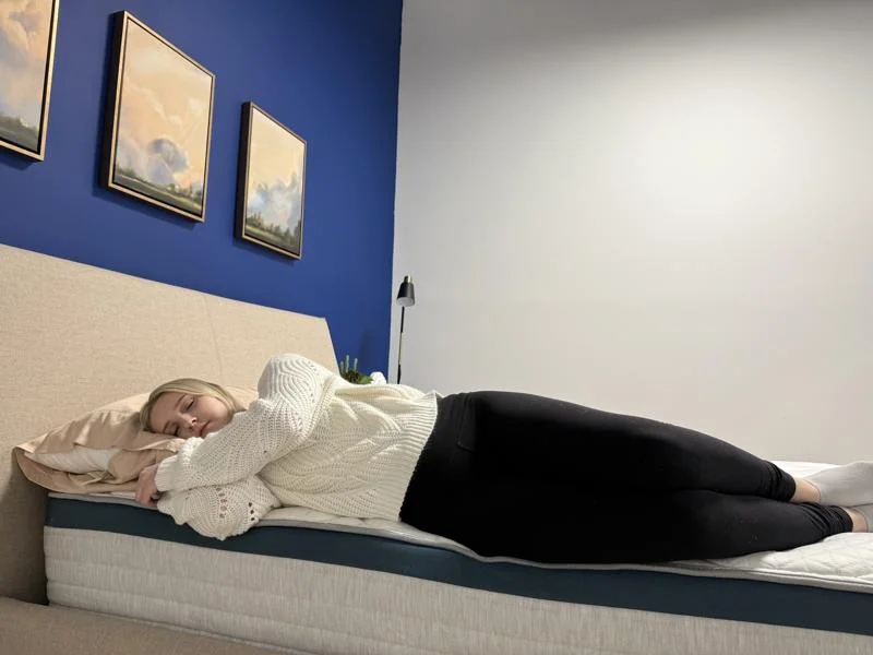 Our tester side-sleeping full body edge support test of the Helix Twilight Mattress
