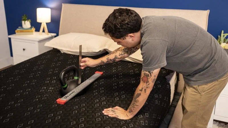 Kettlebell sinkage test on the Beautyrest Black Hybrid XCS Mattress