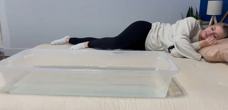 Our tester performs a ripple test on the Avocado Eco Organic Mattress