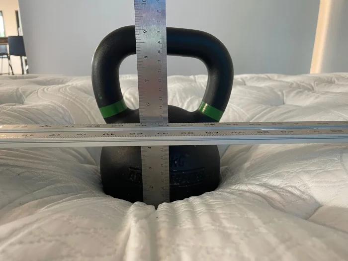 Measuring kettlebell deflection on a Wolf Mattress.