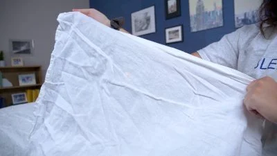 holding up the tuft and needle linen sheets