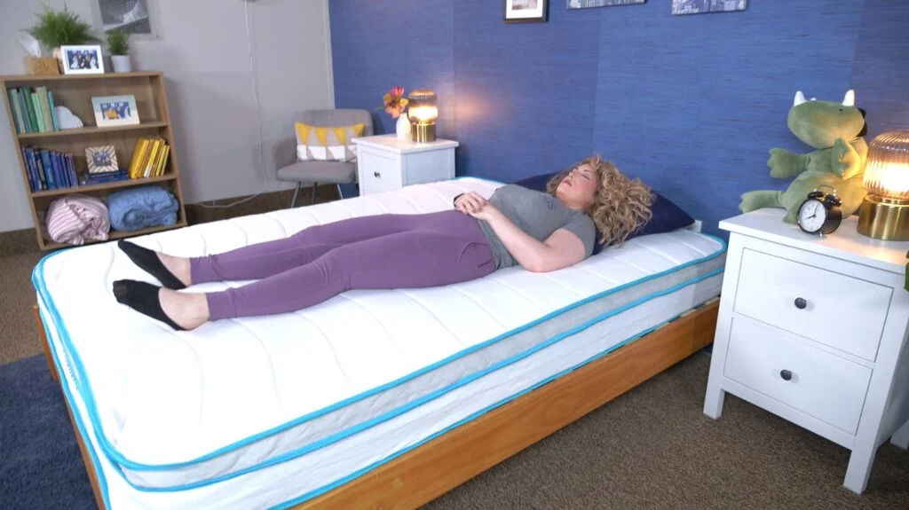 Nichole back sleeping on the Linenspa Hybrid Mattress.