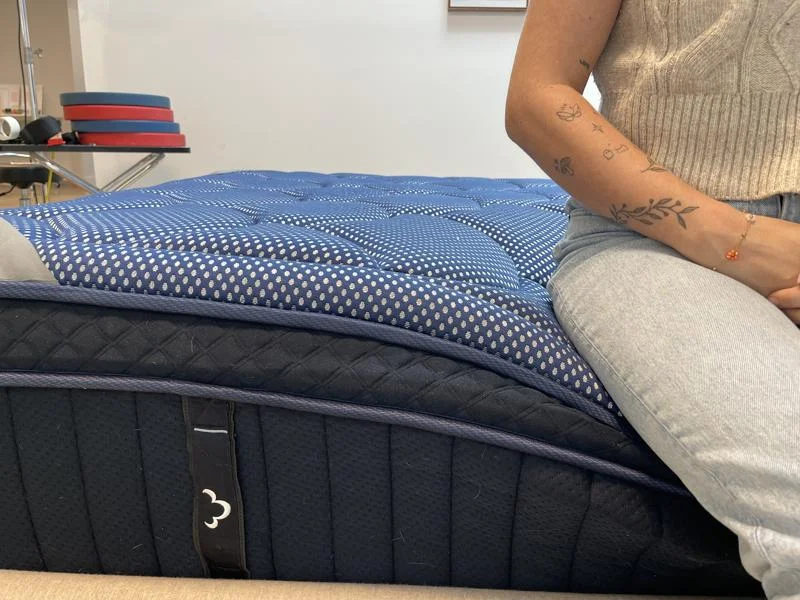 Seated edge support test on the DreamCloud Luxe Memory Foam Mattress