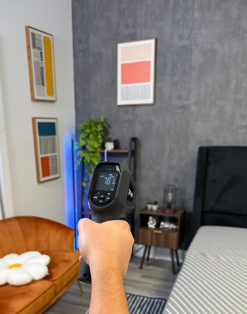 Using a thermal gun to measure the surface temperature of the Siena mattress.