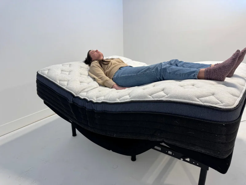 Our tester tries the Helix Midnight Luxe on an adjustable bed.