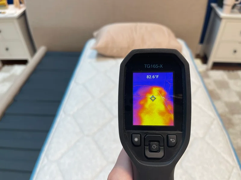 Our tester using a thermal gun to measure the surface temperature of the Bear Cub