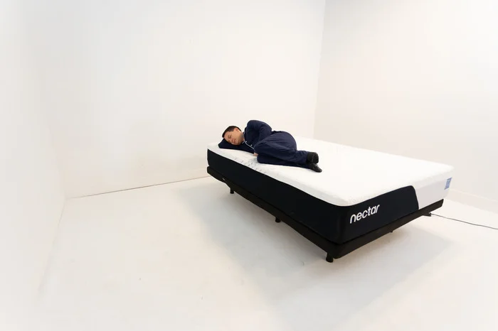 A man side sleeping on the Nectar mattress.
