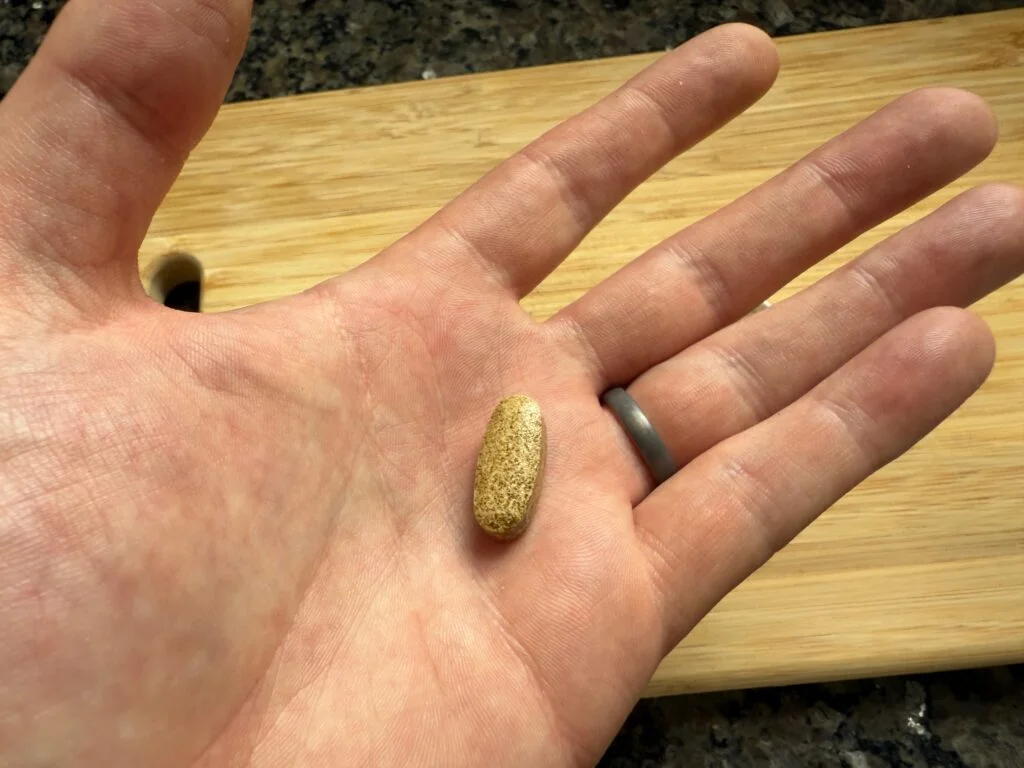 Garden of Life Sleep Well capsule in hand