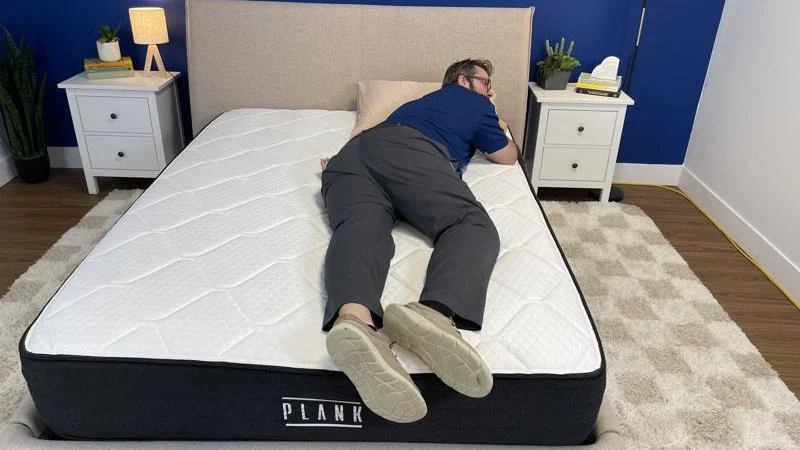 Our tester stomach sleeping on the Brooklyn Bedding Plank Firm Luxe Mattress