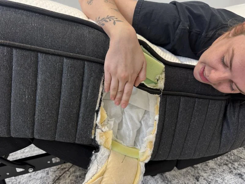 Our tester looks at the construction of a Titan Plus Luxe mattress.